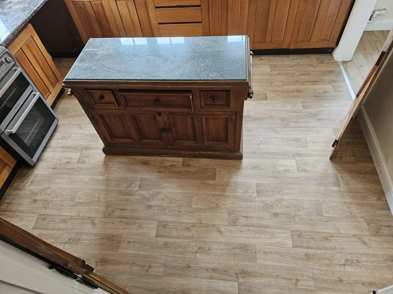 Patterned vinyl flooring fitted in a kitchen